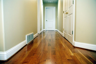 Mid-sized elegant medium tone wood floor and purple floor living room photo in Seattle