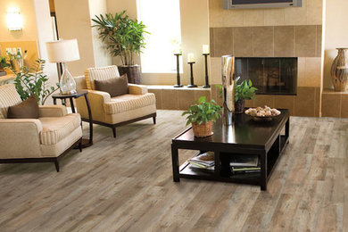 Living room - large open concept medium tone wood floor living room idea in Denver