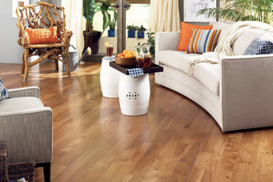 Example of a classic medium tone wood floor living room design in Boston