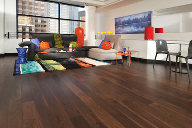 Example of a large trendy open concept dark wood floor living room design in Charleston with white walls
