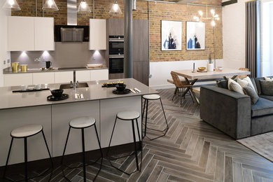 Photo of a contemporary living room in London with porcelain flooring and grey floors.