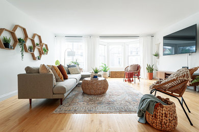 Transitional light wood floor living room photo in Other with white walls
