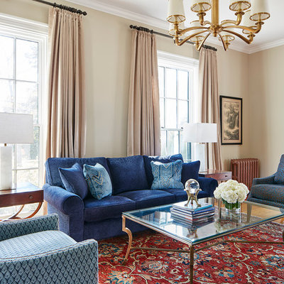 Living room - mid-sized traditional formal and open concept light wood floor and brown floor living room idea in Boston with beige walls, no fireplace and no tv
