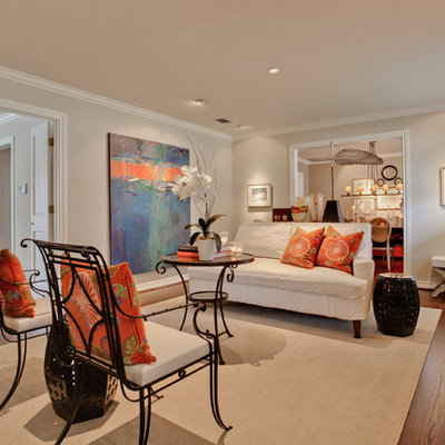 Living room - mid-sized transitional enclosed dark wood floor living room idea in Dallas with beige walls, a standard fireplace, a stone fireplace and no tv