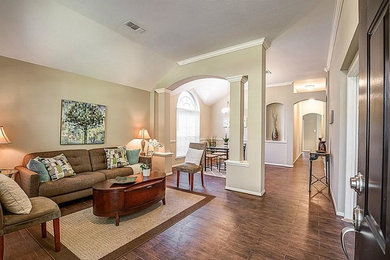 Mid-sized transitional open concept and formal ceramic tile and brown floor living room photo in Houston with beige walls, no fireplace and no tv
