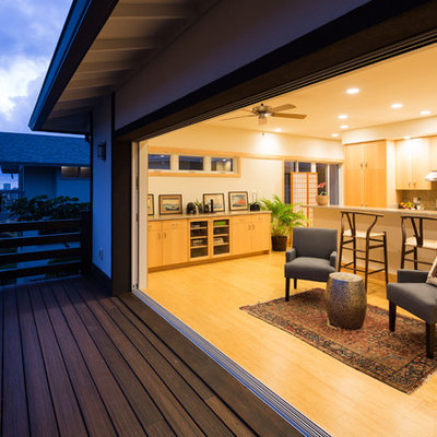 Example of a mid-sized open concept bamboo floor living room design in Hawaii