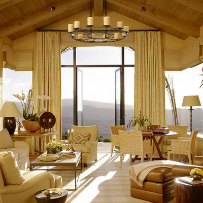 Large tuscan living room photo in San Francisco with a standard fireplace and no tv