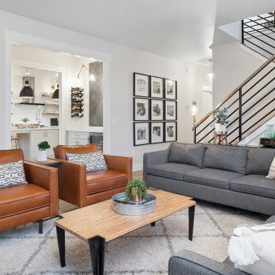 Living room - transitional open concept brown floor living room idea in Other with white walls