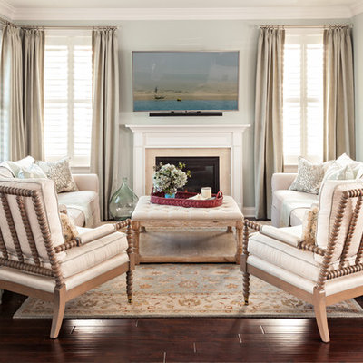 Example of a small beach style open concept dark wood floor living room design in Boston with a standard fireplace, blue walls, a stone fireplace and a wall-mounted tv