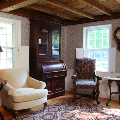 Example of a mid-sized country formal and enclosed carpeted living room design in Boston with multicolored walls, no fireplace and no tv