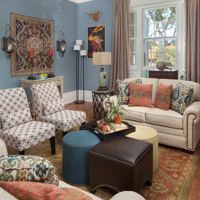 Elegant formal medium tone wood floor living room photo in Philadelphia with blue walls