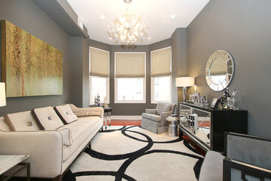 Example of a mid-sized trendy formal and enclosed medium tone wood floor living room design in DC Metro with gray walls and no tv