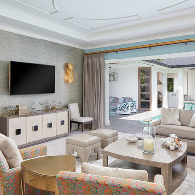 Example of a transitional living room design in Orlando with blue walls and a wall-mounted tv