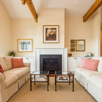 Living room - traditional formal and open concept exposed beam living room idea in Seattle with beige walls, a standard fireplace and no tv