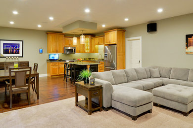 This is an example of a medium sized modern open plan living room in Cleveland with a wall mounted tv.