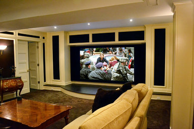 Example of an enclosed carpeted living room design in New York with a media wall