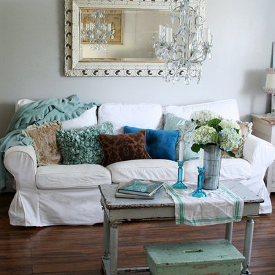 Inspiration for a shabby-chic style living room remodel in Other with white walls