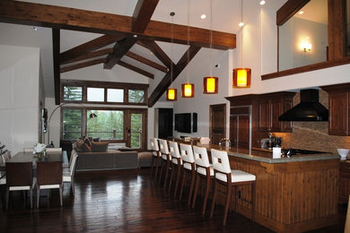 Inspiration for a dark wood floor living room remodel in Denver with beige walls and a stone fireplace