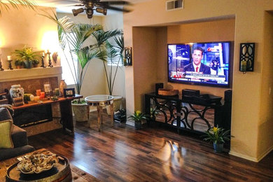 Living room - modern open concept dark wood floor living room idea in Orange County with a wall-mounted tv