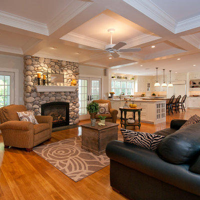 Example of a classic living room design in Boston with a standard fireplace and a stone fireplace