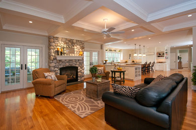 Example of a classic living room design in Boston with a standard fireplace and a stone fireplace