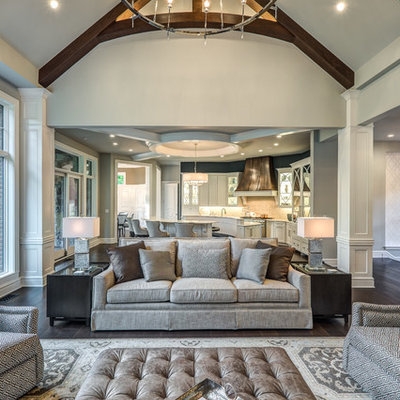 Living room - large transitional open concept dark wood floor and brown floor living room idea in Cincinnati with gray walls, a standard fireplace, a tile fireplace and a wall-mounted tv