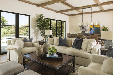 Example of a transitional formal and open concept living room design in Los Angeles with white walls