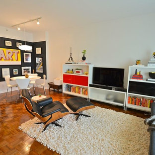 Mid-sized 1960s medium tone wood floor living room photo in Minneapolis with white walls, no fireplace and a tv stand