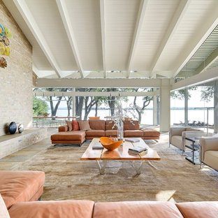 Example of a large mid-century modern open concept and formal slate floor and multicolored floor living room design in Austin with a standard fireplace and a brick fireplace