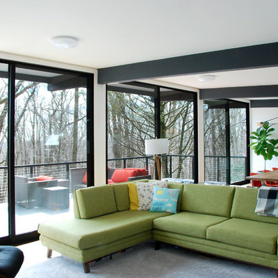 Living room - mid-sized 1960s open concept cork floor and brown floor living room idea in Philadelphia with white walls, a standard fireplace, a plaster fireplace and a wall-mounted tv