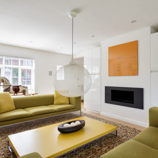 Inspiration for a contemporary open plan living room in Kent with white walls and medium hardwood flooring.
