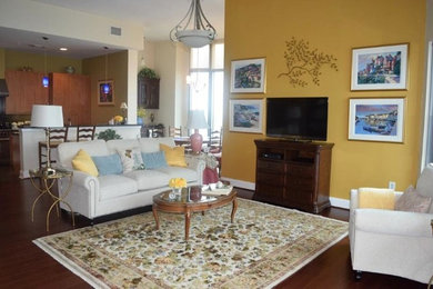 Example of a mid-sized transitional living room design in Austin with yellow walls