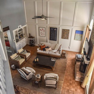 Living room - huge contemporary open concept medium tone wood floor living room idea in Houston with a bar, white walls, a standard fireplace, a brick fireplace and a wall-mounted tv