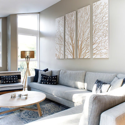 Living room - contemporary formal and open concept medium tone wood floor living room idea in Sydney with gray walls and a tv stand