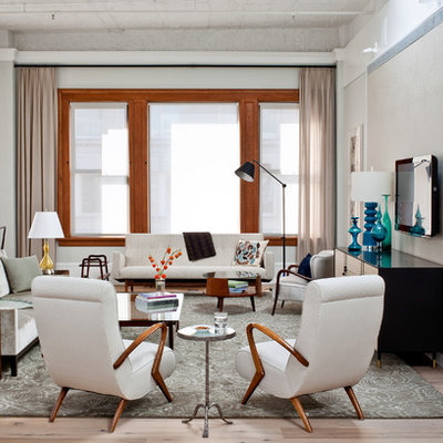 Example of a trendy living room design in New York with gray walls