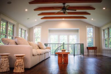 Living room library - huge farmhouse loft-style dark wood floor, brown floor and exposed beam living room library idea in Other with white walls, a standard fireplace, a stone fireplace and a concealed tv