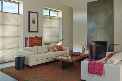 Example of a mid-sized transitional open concept dark wood floor living room design in Portland with beige walls, a standard fireplace and a concrete fireplace