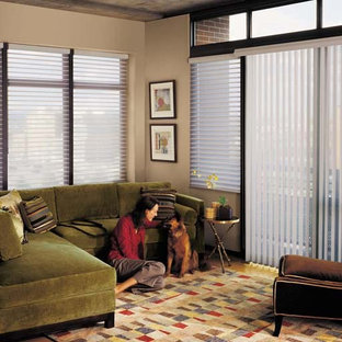 Photo of a mid-sized transitional formal enclosed living room in Other with beige walls, medium hardwood floors, no fireplace, no tv and brown floor.