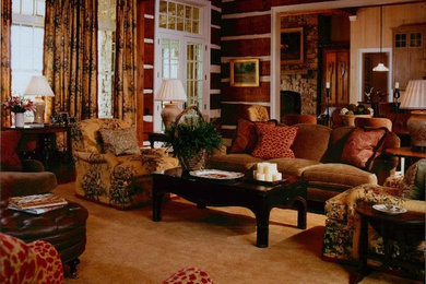 Example of a large classic formal and enclosed dark wood floor living room design in Charlotte with brown walls, a standard fireplace and a wood fireplace surround