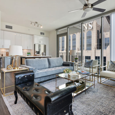 Inspiration for a mid-sized contemporary open concept dark wood floor and brown floor living room remodel in Atlanta with white walls
