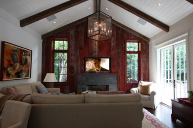 This is an example of a contemporary living room in San Francisco with red walls.