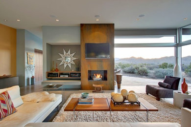 Example of a mid-century modern formal and open concept concrete floor living room design in Los Angeles with a wall-mounted tv