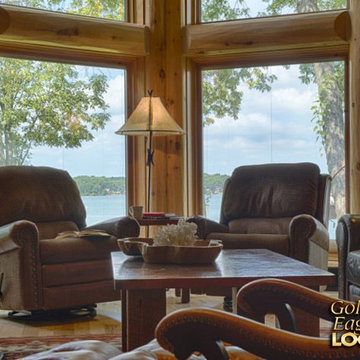 Incredible lake view large Pella windows with massive log trim