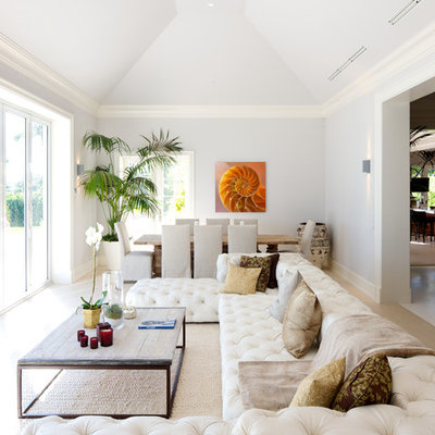 Living room - contemporary light wood floor and beige floor living room idea in Miami with white walls