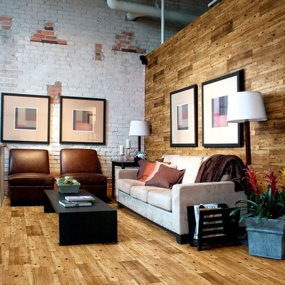 Inspiration for a mid-sized industrial open concept medium tone wood floor living room remodel in London with white walls