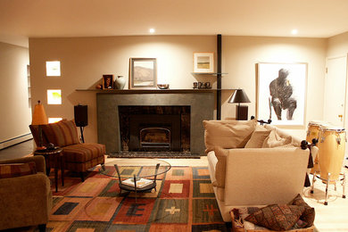 Example of a mid-sized trendy enclosed light wood floor living room design in Seattle with a music area, beige walls, a standard fireplace and a stone fireplace
