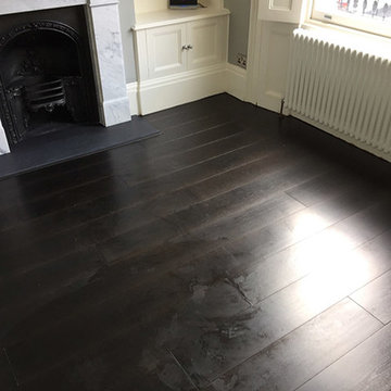 Installing Black Wood Flooring to Premises