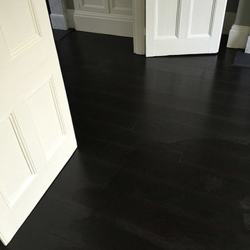 Installing Black Wood Flooring to Premises