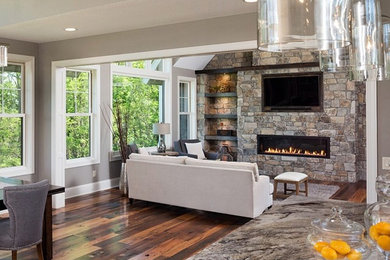 Design ideas for a large traditional open plan living room in Los Angeles with grey walls, dark hardwood flooring, a standard fireplace and a stone fireplace surround.