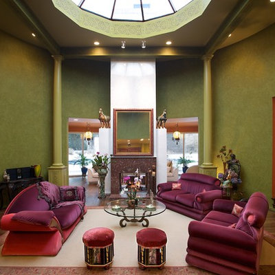 Example of a tuscan living room design in New York with green walls